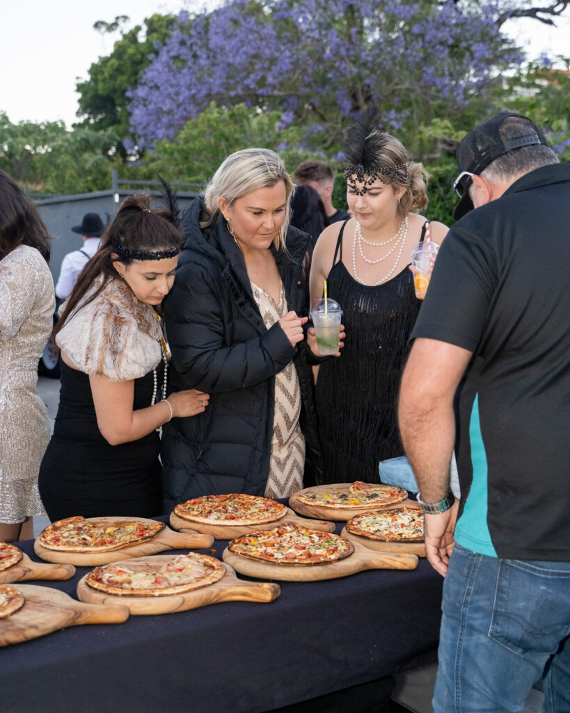 Customers deciding which Pizza to eat first!